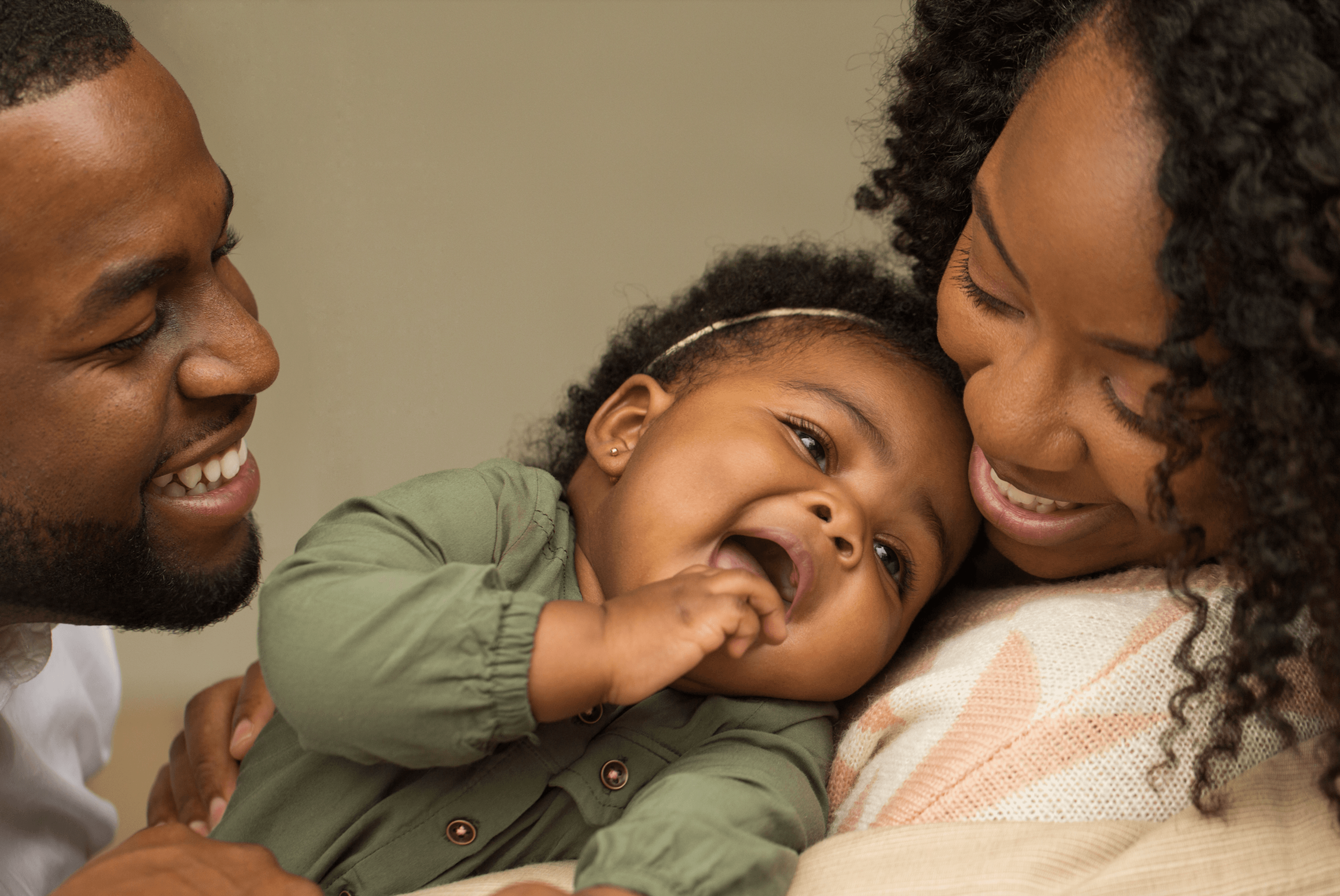 image of two adults and their baby