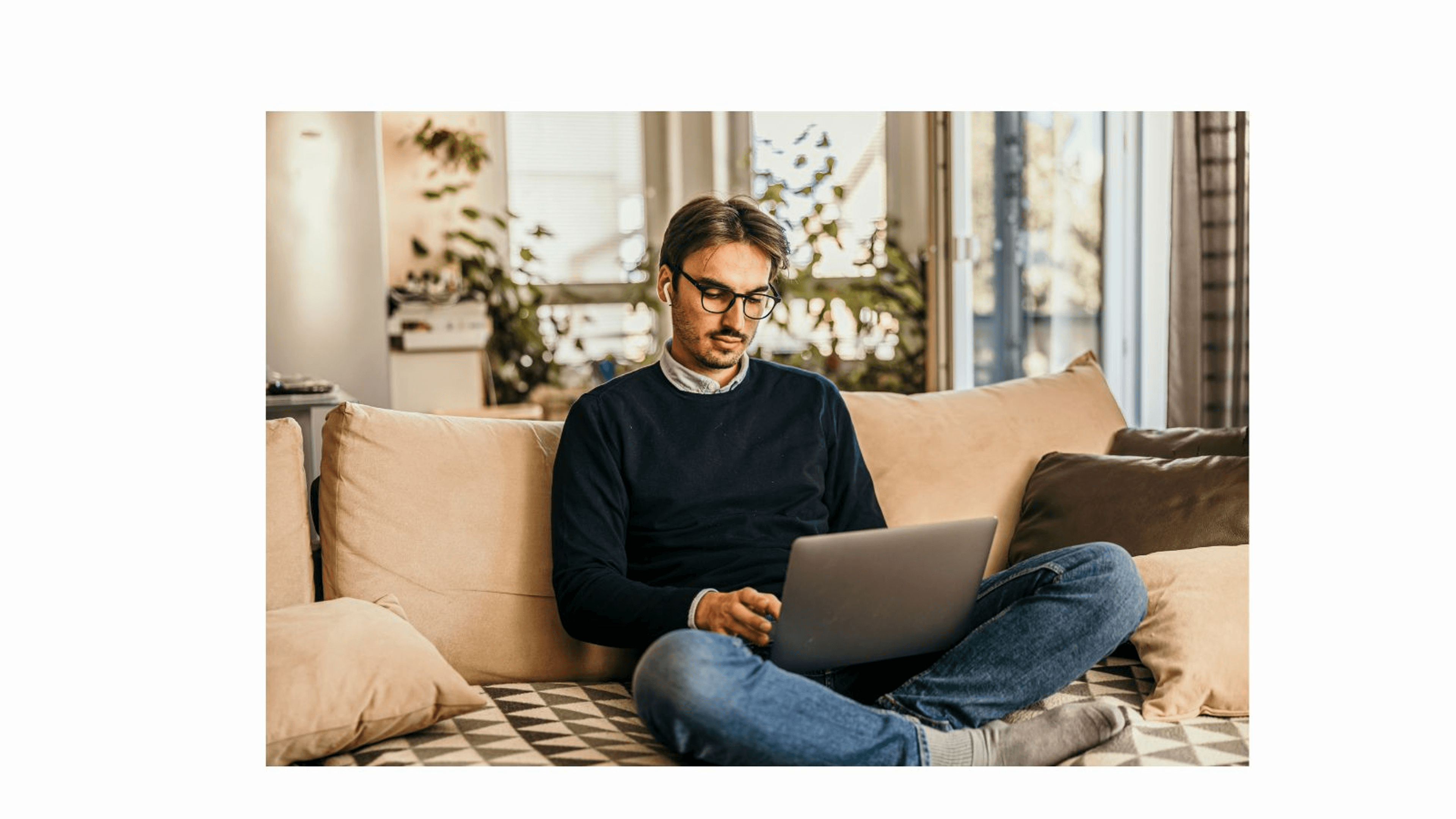 Male on laptop at home