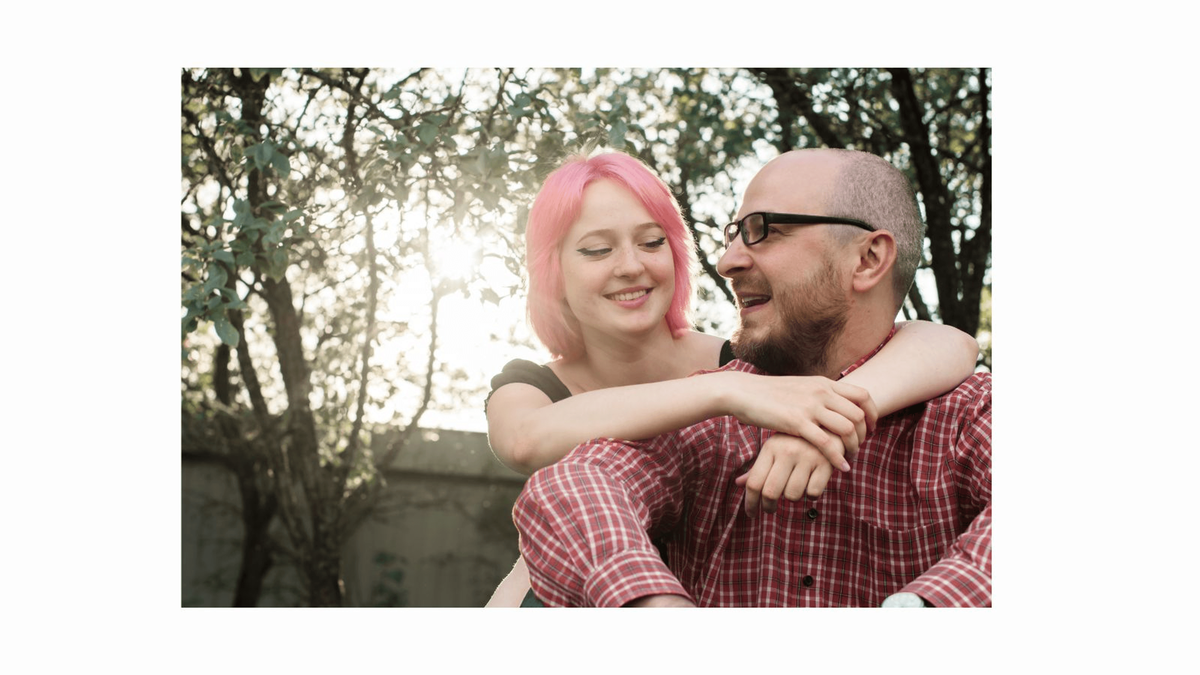 Teenage daughter cuddling father