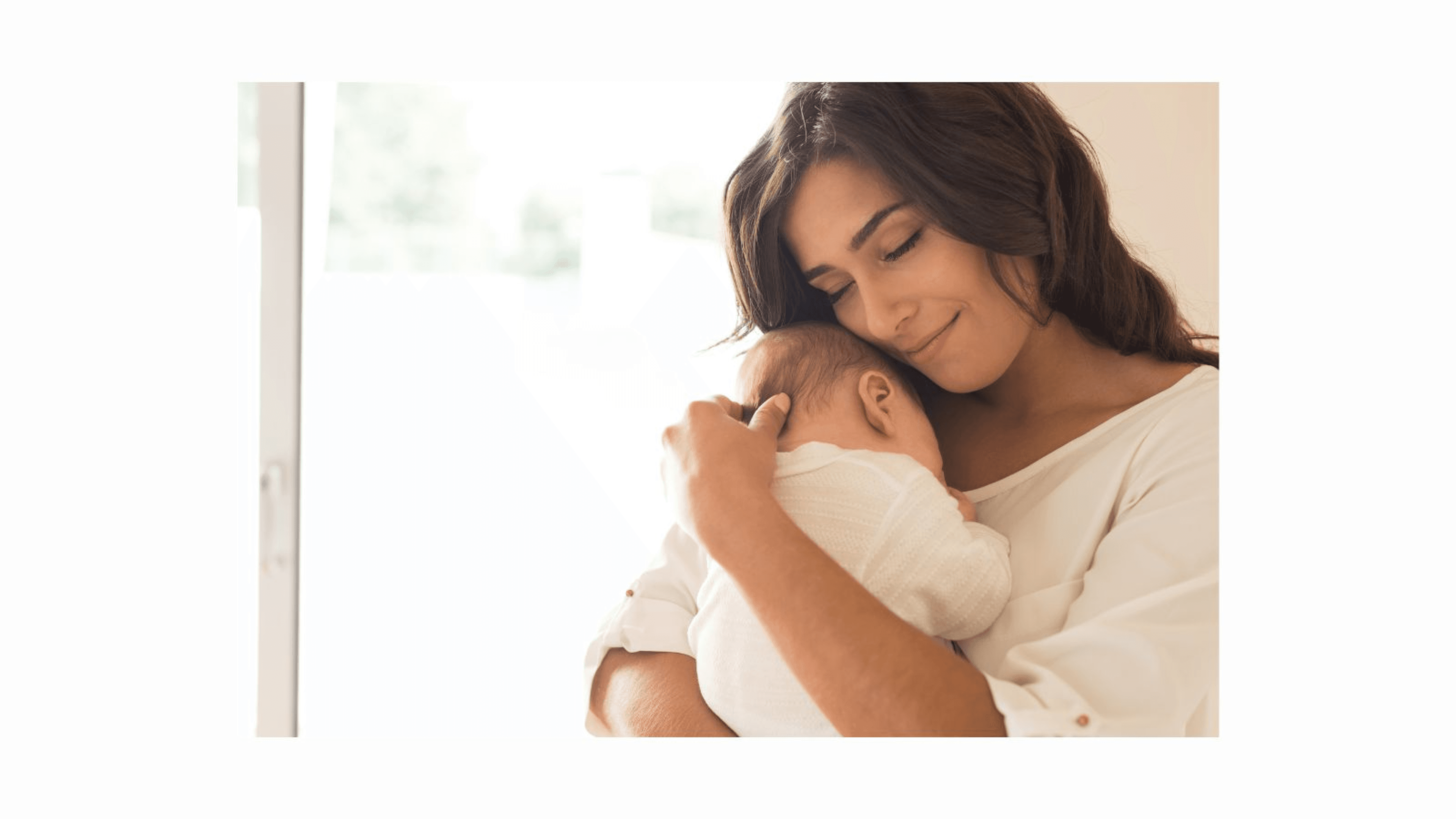 Mother cuddling baby